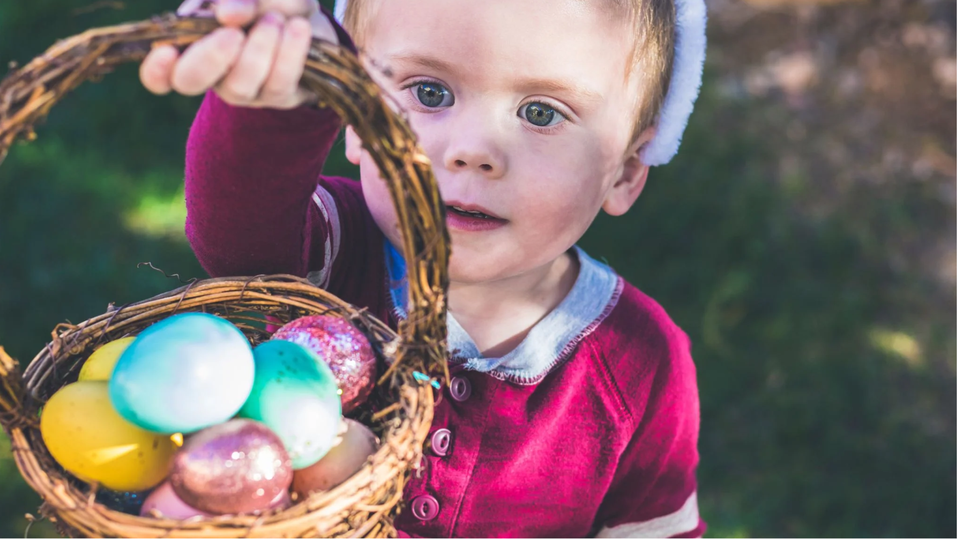 a child holding sweets and chocolates during Easter